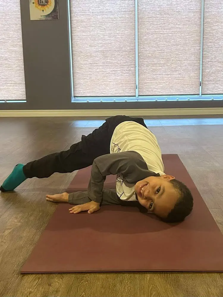 A Yoga Student in Thread the Needle Pose